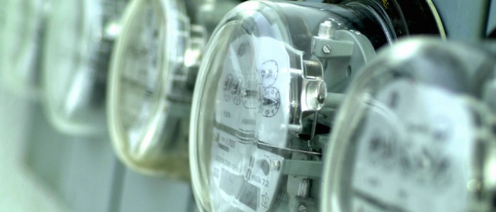 Close up photo of glass covered elctric meters